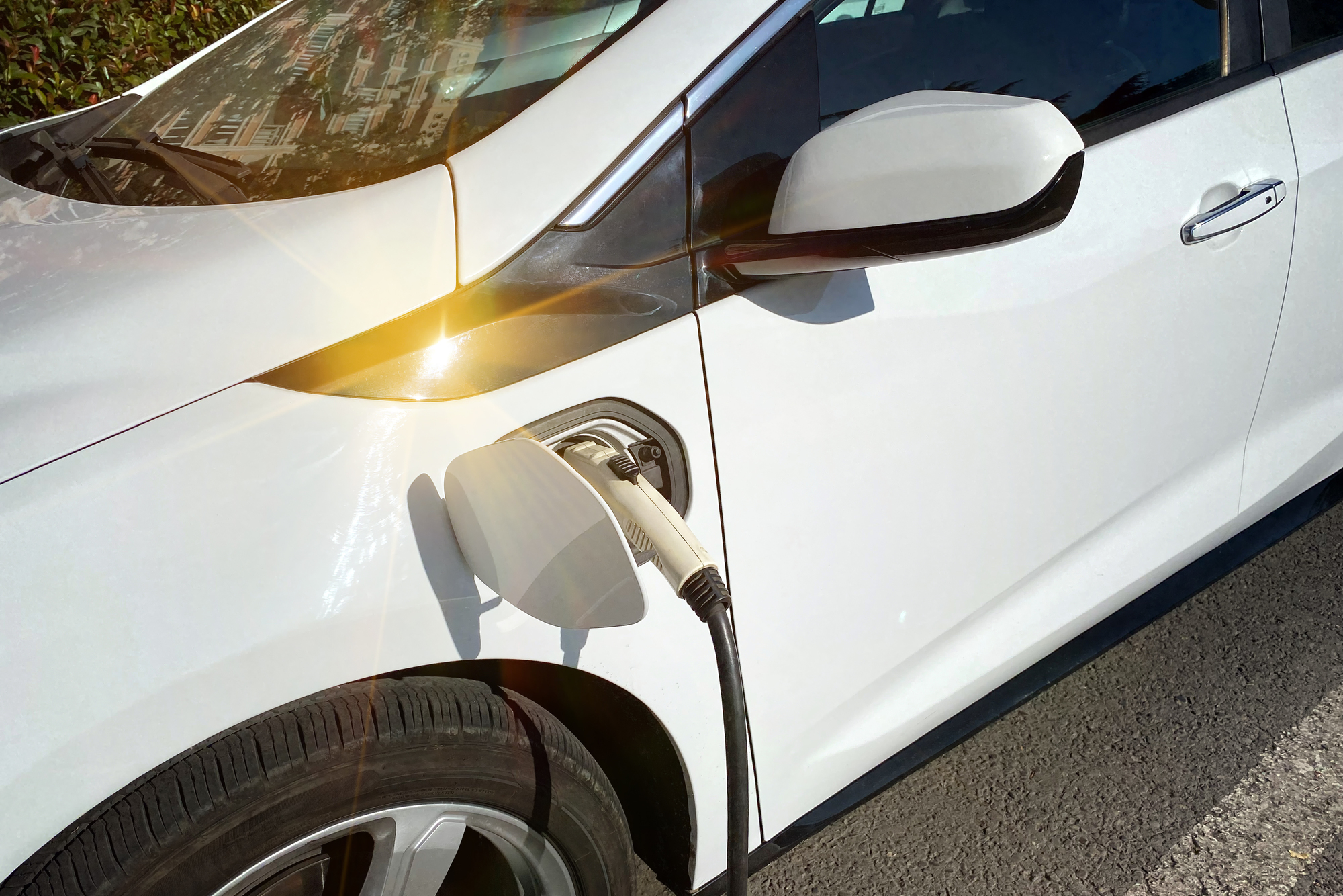 Close-up of a white electric car charger